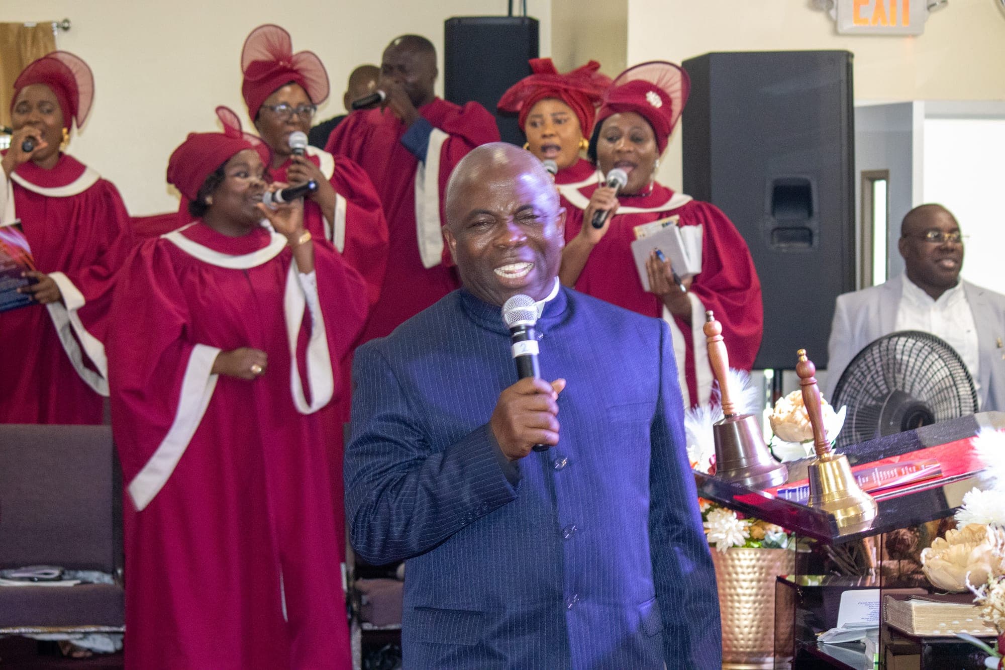 Pastor with the choir in worship